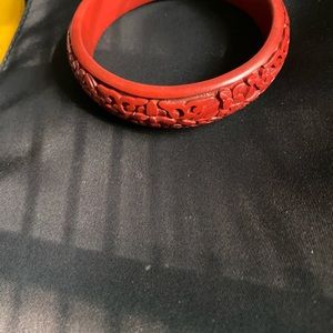 Red carved bracelet .